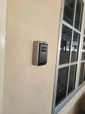 a box on the side of a building with a window at Budi Homestay Taman Jati in Ipoh