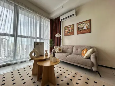 a living room with a couch and a table at Le Cozy Cabin - 2B2R SeaCity View Infinity Pool in George Town
