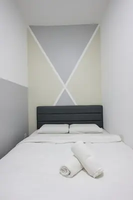a white bed with two towels on it at Top 3 Homestay Palas Horizon Brinchang Cameron Highland -C Home Luxury A-3-18 in Brinchang