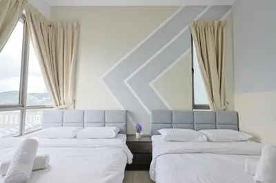 two beds in a room with large windows at Top 3 Homestay Palas Horizon Brinchang Cameron Highland -C Home Luxury A-3-18 in Brinchang