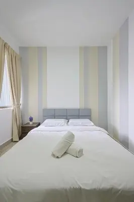 a white bed with a white pillow on it at Top 3 Homestay Palas Horizon Brinchang Cameron Highland -C Home Luxury A-3-18 in Brinchang