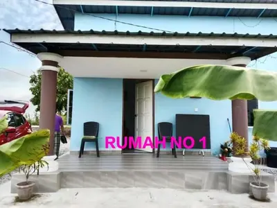 a blue house with a sign that reads runnin at Aziyaa Homestay rumah no1 in Sungai Besar