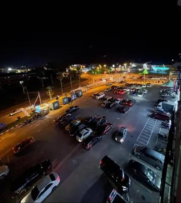 a parking lot with cars parked in a parking lot at GR studio APARTMENT 2 - kompleks MUTIARA gua MUSANG in Gua Musang