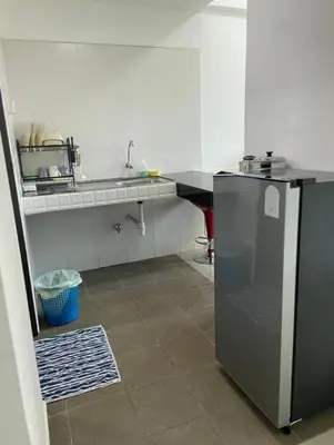 a kitchen with a sink and a refrigerator at GR studio APARTMENT 2 - kompleks MUTIARA gua MUSANG in Gua Musang