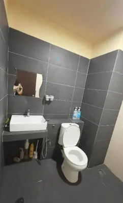 a bathroom with a toilet and a sink at GR studio APARTMENT 3 - kompleks MUTIARA gua MUSANG in Gua Musang