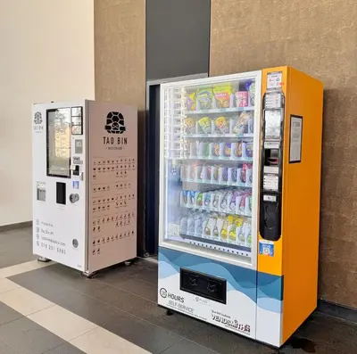 a drink vending machine next to a drink cooler at The Urban Suites City&seaview in Jelutong
