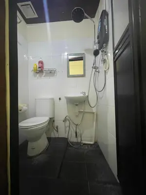 a small bathroom with a toilet and a sink at Pearl Heritage Homestay in George Town