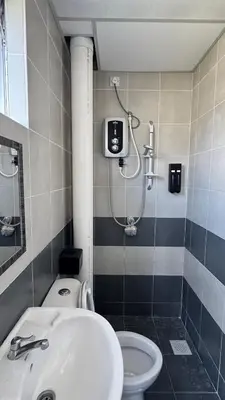 a bathroom with a shower and a toilet and a sink at DADDY HOMES 4 EMERALD AVENUE CENTRUM Brinchang View in Brinchang