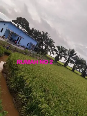 a house with a sign that reads runamb no at Aziyaa homestay rumah no2 in Sungai Besar