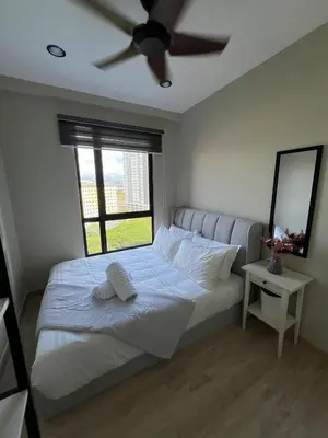 a bedroom with a bed with a ceiling fan at Modern Two Bedroom Ipoh City Apartment with Pool, Gym and Free Parking in Ipoh