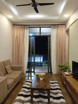 a living room with a couch and a table at Bayt Rizq Homestay 3R2B in Brinchang