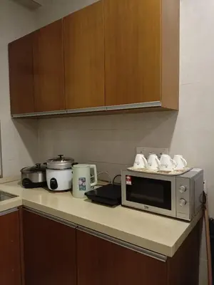 a microwave on a counter in a kitchen at Bayt Rizq Homestay 3R2B in Brinchang