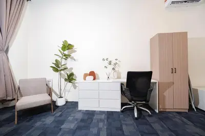 an office with a desk and a chair and a cabinet at Georgetown Heritage 1F stay 10pax 3BR in George Town