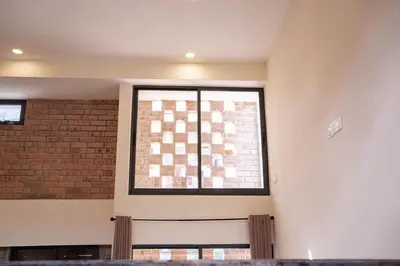a window in a room with a brick wall at Georgetown Heritage 1F stay 10pax 3BR in George Town