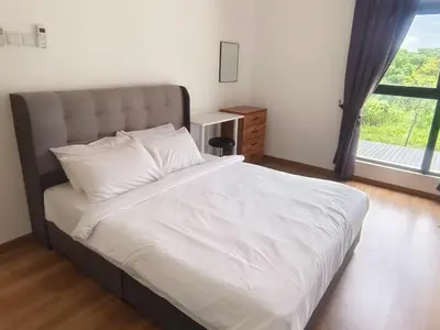 a bedroom with a large bed with a large window at The Cove Signature Hillside Ipoh by MW in Ipoh