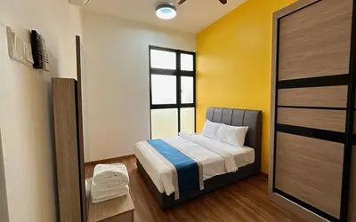 a small bedroom with a bed and a window at The Cove Signature Hillside Ipoh by MW in Ipoh