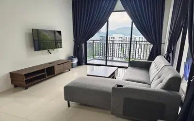 a living room with a couch and a large window at The Cove Signature Hillside Ipoh by MW in Ipoh