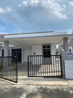 a white house with a gate in front of it at HSKeladanImpian in Gua Sai