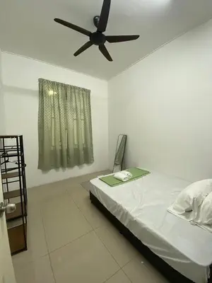 a bedroom with a bed with a ceiling fan at HSKeladanImpian in Gua Sai
