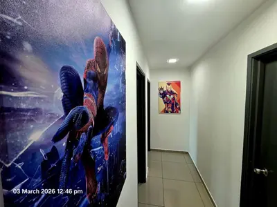 a painting of a bird on a wall in a hallway at Marvel Nest- 3bedroom-Poolview-10pax in Bukit Mertajam