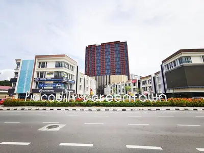 an empty street in a city with tall buildings at DG HomestayMuslim Piccadilly Ipoh Pool View in Ipoh