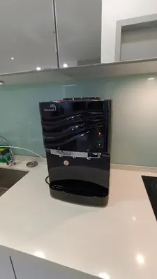 a black appliance sitting on top of a counter at Straits Garden Penang 2BR in Jelutong