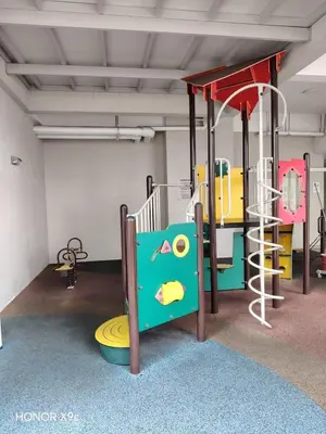 a play room with a playground with a slide at Straits Garden Penang 2BR in Jelutong