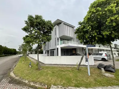 a white house with cars parked in front of it at Lakeside house in Gua Sai