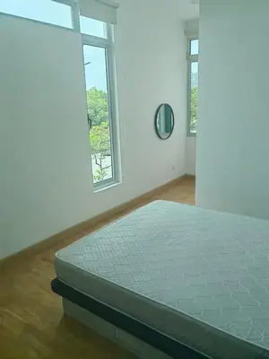 a white room with a bed and two windows at Lakeside house in Gua Sai