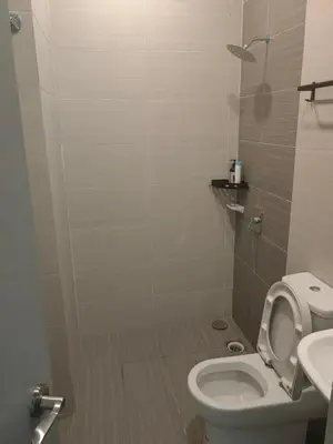 a bathroom with a toilet and a sink at Lakeside house in Gua Sai