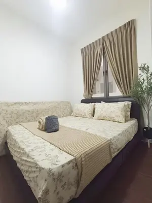a large bed in a bedroom with a window at Shahiqa Palas Horizon Residence in Cameron Highlands