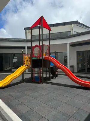 a playground with a slide in front of a building at Shahiqa Palas Horizon Residence in Cameron Highlands