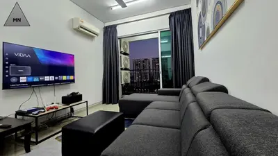 a living room with a couch and a flat screen tv at ModernNest-V1-PS5-sleep10 in Bukit Mertajam