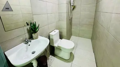 a bathroom with a toilet and a sink at ModernNest-V1-PS5-sleep10 in Bukit Mertajam