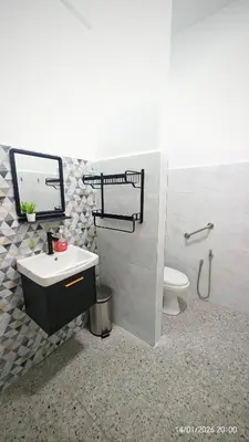 a bathroom with a sink and a toilet at Homestay Si Manja Kini Bertam 4 Bilik Semi D 2 Tingkat in Kepala Batas
