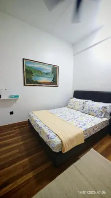 a bedroom with a bed and a painting on the wall at Homestay Si Manja Kini Bertam 4 Bilik Semi D 2 Tingkat in Kepala Batas