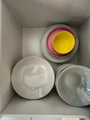 three white plates in a box at Le Jardin Suite 8 Pax Sea View Infinity Pool in George Town
