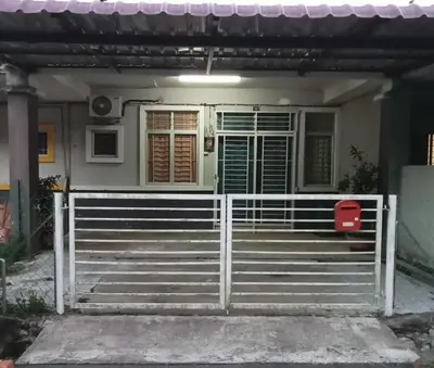 a house with a gate and stairs in front of it at Hani Homestayz2U in Kuala Lipis