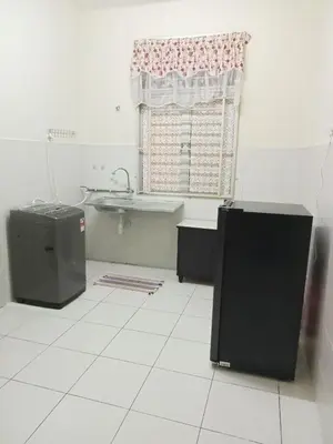 a bathroom with a tub and a sink and a window at Hani Homestayz2U in Kuala Lipis