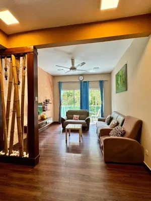 a living room with two couches and a table at Ayaan Bliss Homestay at QuintetTanahRata in Cameron Highlands