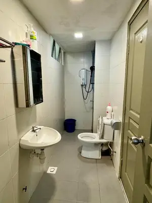 a bathroom with a toilet and a sink at Ayaan Bliss Homestay at QuintetTanahRata in Cameron Highlands