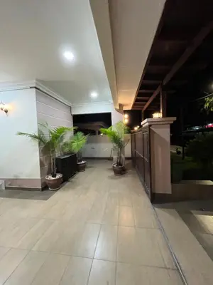 a lobby with potted plants in a building at KK Homestay Ipoh in Ipoh