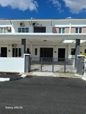 a white house with a fence in front of it at Classic Home Stay in Kuala Ketil