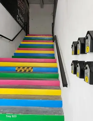 a group of colorful stairs in a room at Tasek Cermin Roomstay in Ipoh