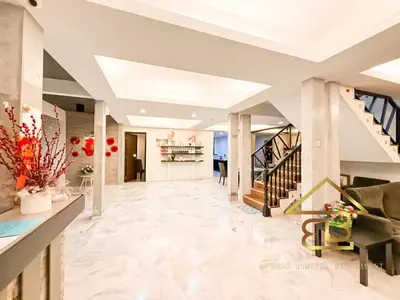 a living room with a staircase and a lobby at ComfortCottage Ipoh Coliving & Whole Unit in Ipoh