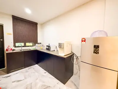 a kitchen with a refrigerator and a sink at ComfortCottage Ipoh Coliving & Whole Unit in Ipoh