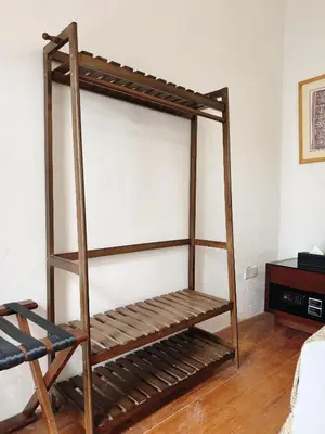 a wooden bunk bed in a room at Courtyard by Heritage Row in George Town