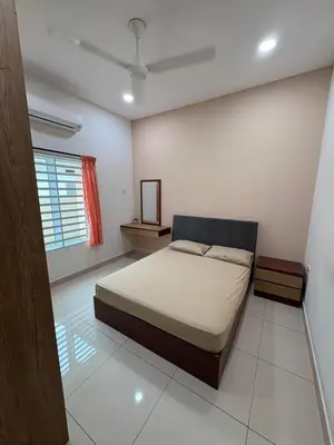 a bedroom with a bed and a window at KK Homestay Ipoh in Ipoh