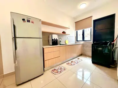 a kitchen with a stainless steel refrigerator on the floor at Modern Stylish 4BR Family House I Machang Bubuk in Bukit Mertajam