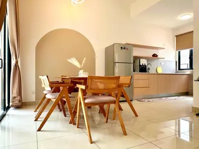 a dining room with a wooden table and chairs at Modern Stylish 4BR Family House I Machang Bubuk in Bukit Mertajam